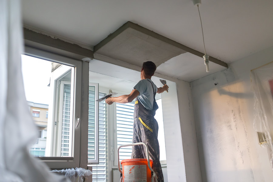 Painting a commercial building ceiling in Fort Wayne